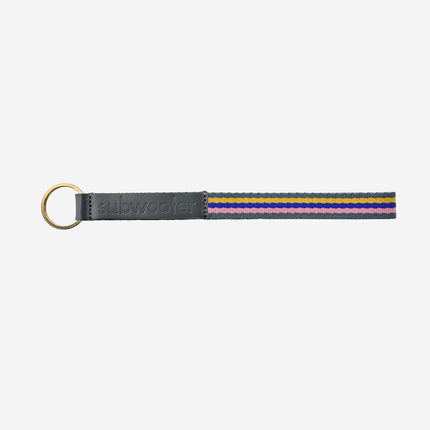 subwooferdog-key-ring-with-grey-stamped-leather-tab-pink-yellow-and-blue-striped-webbing-and-brass-split-ring
