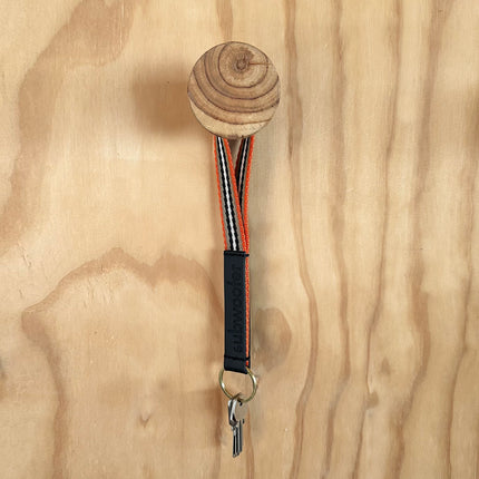 subwooferdog-orange-sand-keyring-on-coat-hook